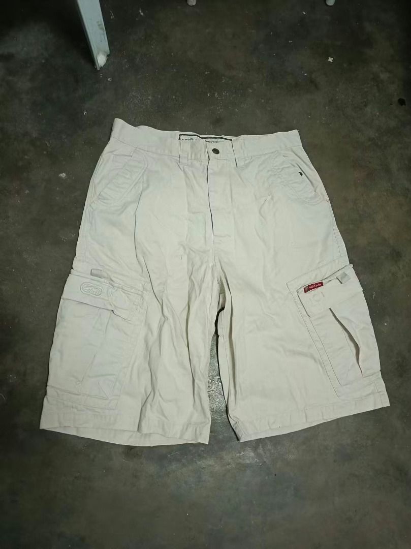 Ecko Unltd Cargo Shorts Beige Size 34 (Category: Shorts) located in Rizal. Submitted by skilidilidu (Listing ID 1465286534, Image 1). Description: - Brand: Ecko Unltd - Style: Heavy utility cargo shorts - Color: Classic beige - Material: Durable, high-quality cotton - Features: Multiple functional pockets, button fly closure - Branding: Red tag on side pocket with embroidered rhino logo - Vibe: Perfect streetwear piece.