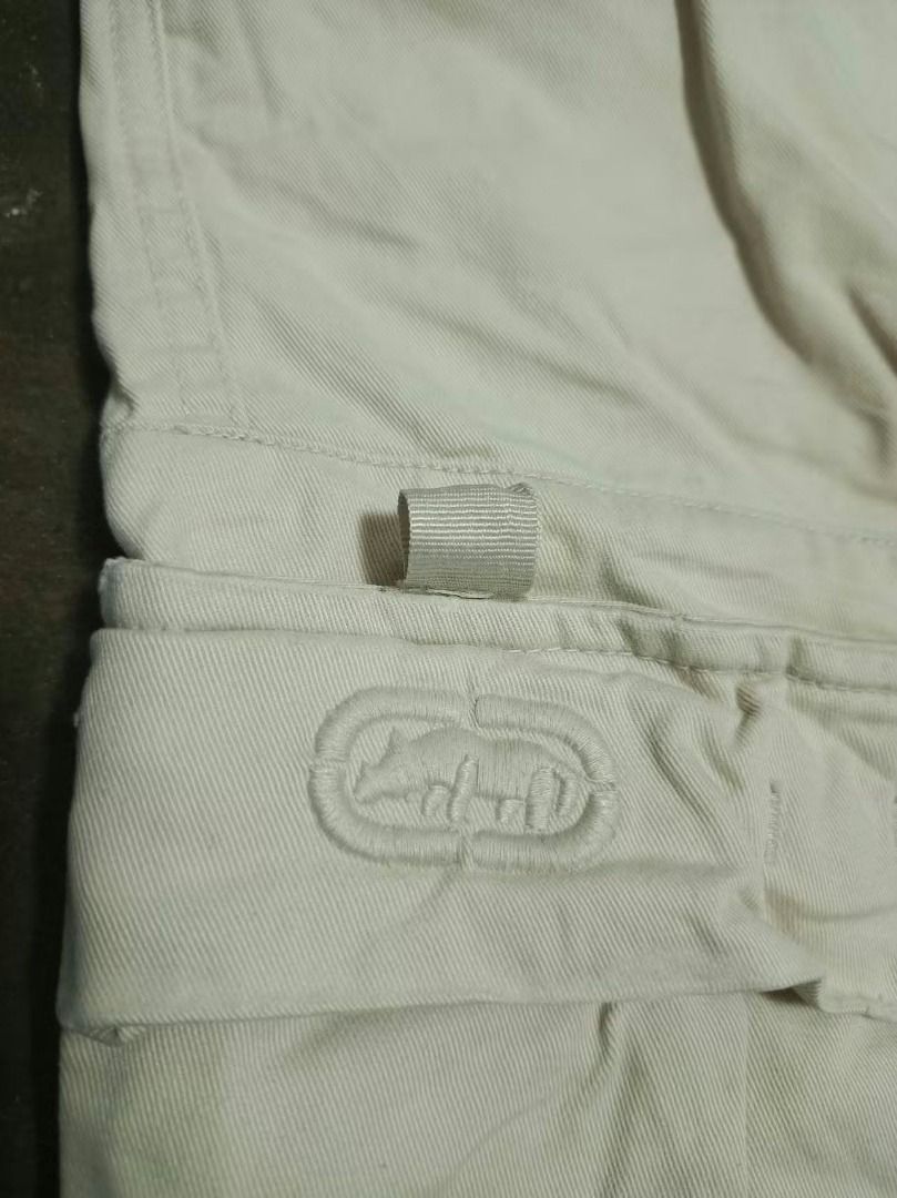 Ecko Unltd Cargo Shorts Beige Size 34 (Category: Shorts) located in Rizal. Submitted by skilidilidu (Listing ID 1465286534, Image 3). Description: - Brand: Ecko Unltd - Style: Heavy utility cargo shorts - Color: Classic beige - Material: Durable, high-quality cotton - Features: Multiple functional pockets, button fly closure - Branding: Red tag on side pocket with embroidered rhino logo - Vibe: Perfect streetwear piece.