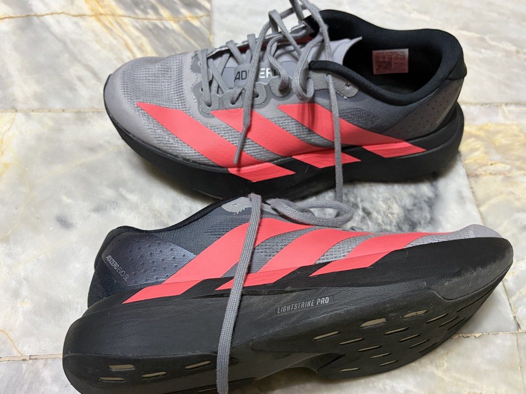 Evo SL (Category: Sneakers) located in Mandaluyong City. Submitted by efaye.c (Listing ID 1465268239, Image 2). Description: Adizero EVO SL Shoes Size: US M5.5 / W6.5 Colour: Core Black / Solar Turbo / Light Onix Us Bought Sep 2026 for Php 8,900 Used twice RFS: too small.