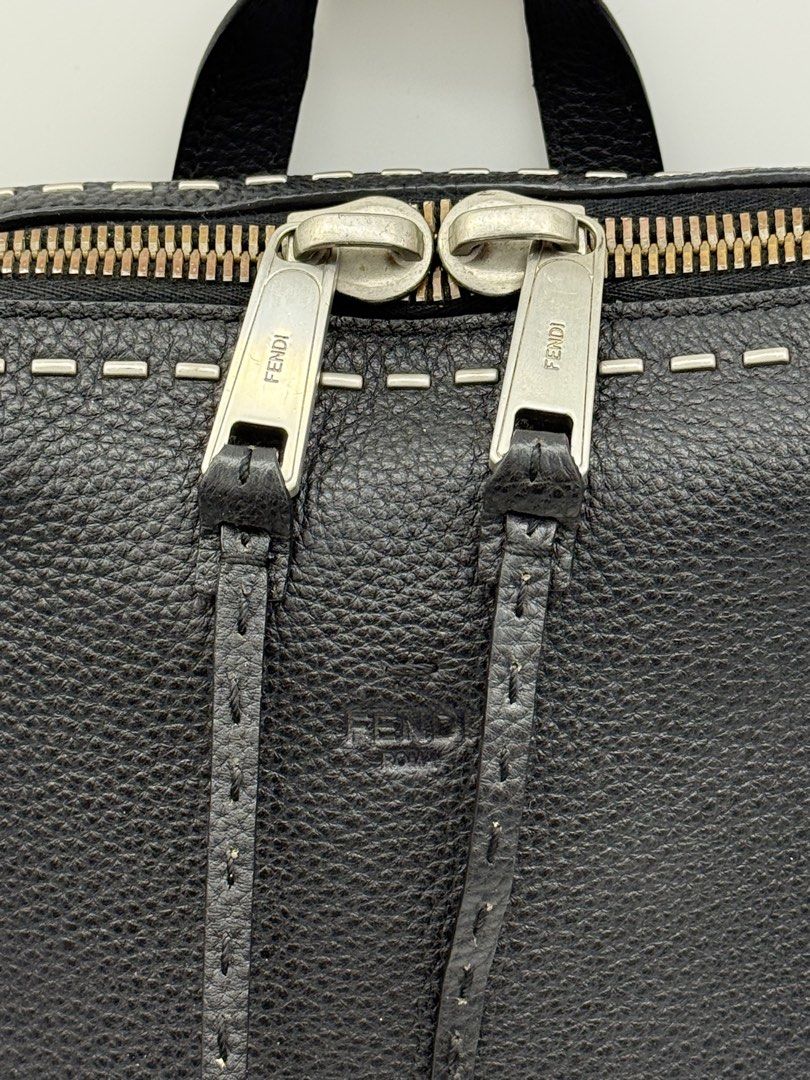 Fendi Black Leather Selleria Backpack (Category: Backpacks) located in Caloocan City. Submitted by rossvault2 (Listing ID 1465241117, Image 2). Description: - Brand: authentic Fendi - Material: Premium black grained leather - Design: Signature Selleria hand-stitched front edges - Closure: Dual zipper with leather pull tabs and engraved Fendi Roma branding - Comfort & Carry: Adjustable shoulder straps and sturdy top handle - Style: Sleek, minimali