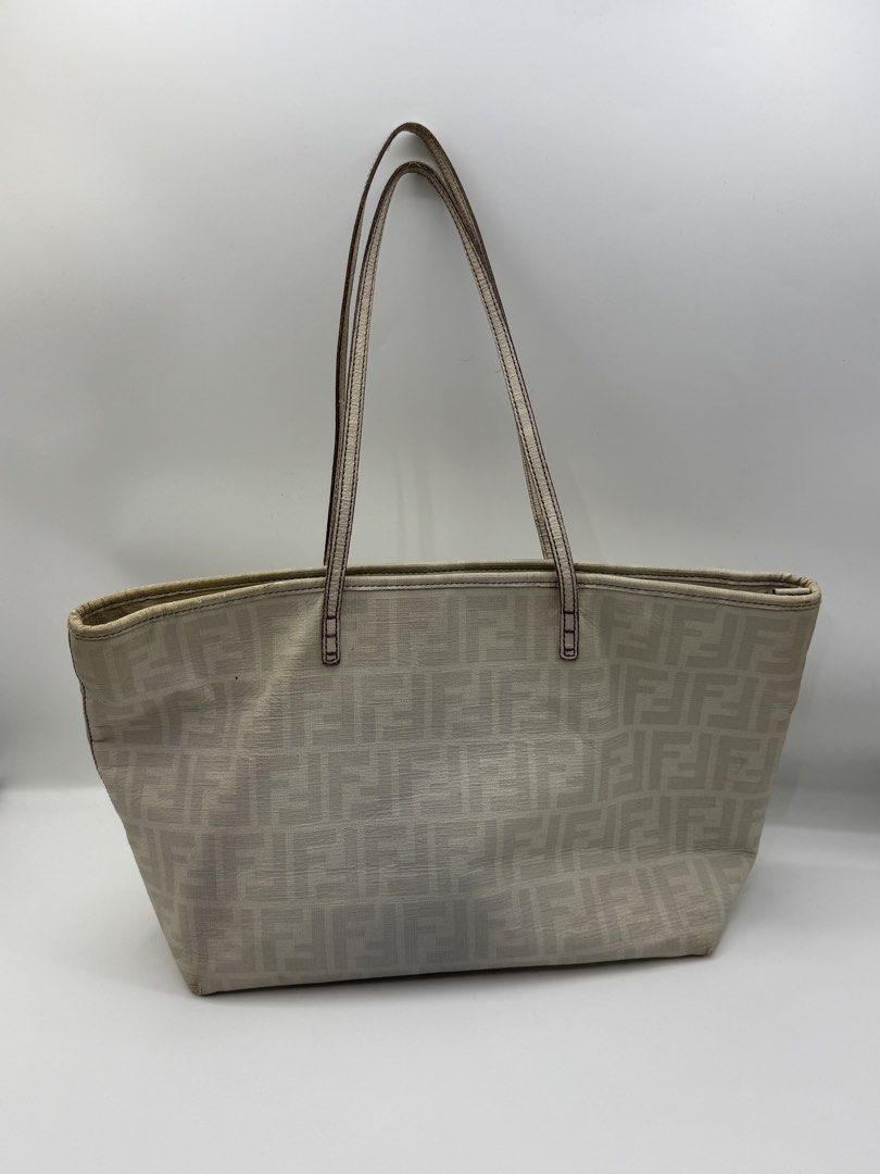 Fendi tote (Category: Tote Bags) located in Caloocan City. Submitted by rossvault2 (Listing ID 1465232301, Image 2). Description: - Brand: Fendi authentic - Style: Zucca Canvas Tote Bag - Color: Beige with purple accents - Straps: Dual shoulder straps with purple stitching - Interior: Purple Zucca pattern fabric lining with zipper pocket - Details: Metal Fendi logo plate and authentic serial number tag inside - Condition: Clean interior/ signs of