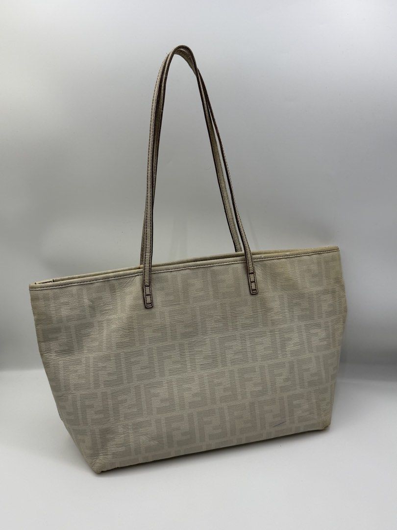 Fendi tote (Category: Tote Bags) located in Caloocan City. Submitted by rossvault2 (Listing ID 1465232301, Image 1). Description: - Brand: Fendi authentic - Style: Zucca Canvas Tote Bag - Color: Beige with purple accents - Straps: Dual shoulder straps with purple stitching - Interior: Purple Zucca pattern fabric lining with zipper pocket - Details: Metal Fendi logo plate and authentic serial number tag inside - Condition: Clean interior/ signs of
