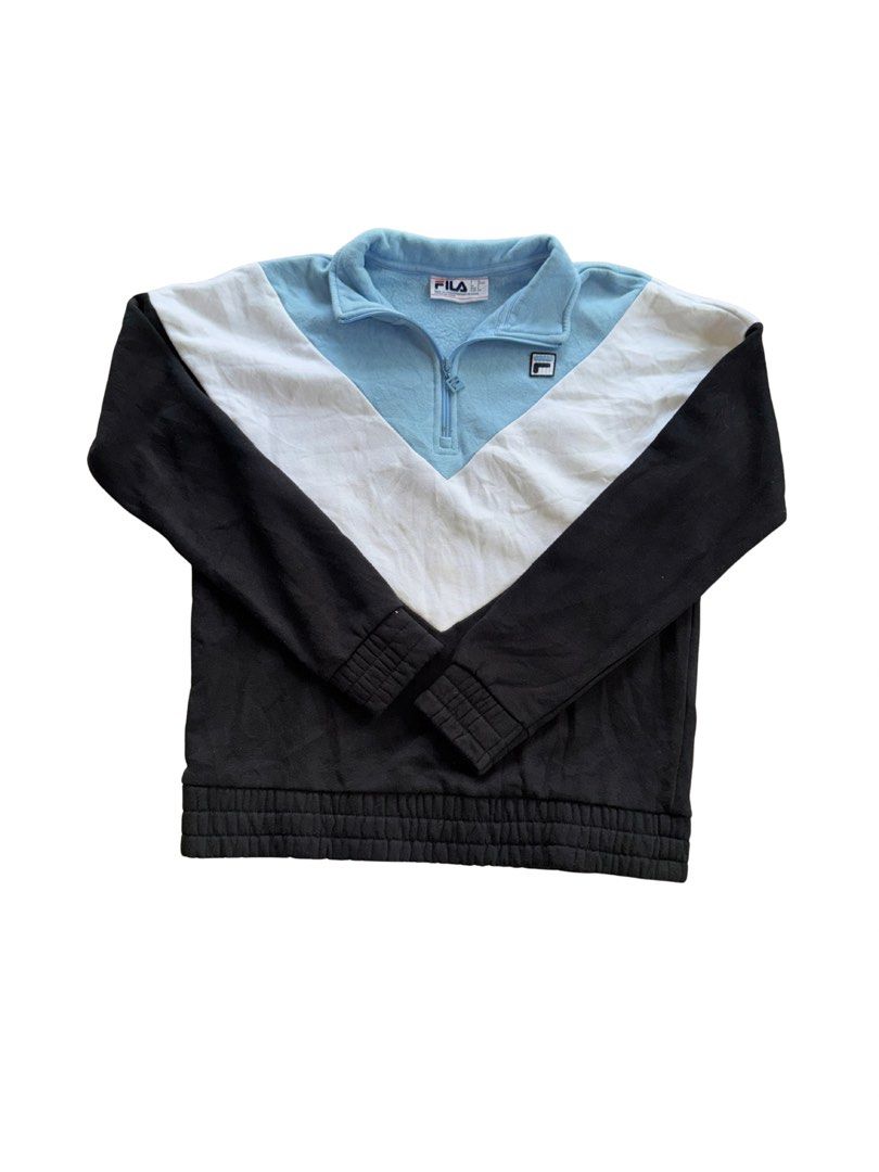 FILA Quarter Zip Sweatshirt Blue White Black (Category: Coats, Jackets and Outerwear) located in Teresa. Submitted by boanerjes (Listing ID 1465212484, Image 1). Description: - Brand: FILA - Style: Quarter zip pullover sweatshirt with colourblock design (light blue, white, and black) - Material: Soft and warm fleece, perfect for daily wear - Details: Ribbed collar, cuffs, and hem - Branding: Embroidered/brand patch on the chest and original colla