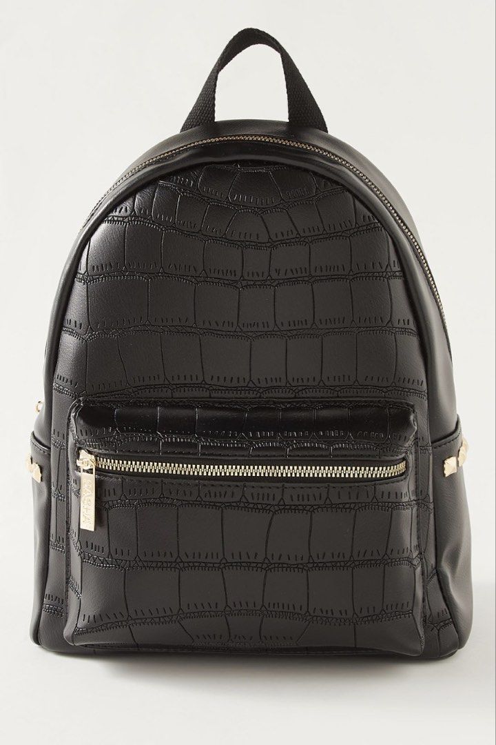Finn Esker Black Crocodile Pattern Mini Backpack (Category: Backpacks) located in Manila. Submitted by lynnalec25 (Listing ID 1465362574, Image 1). Description: - Brand: Finn Esker - Condition: Brand new with original tag attached - Material/Design: Black backpack with a glossy crocodile embossed pattern - Hardware: Elegant gold-tone zippers, including a convenient front pocket - Comfort & Carry: Features a sturdy top handle and adjustable should