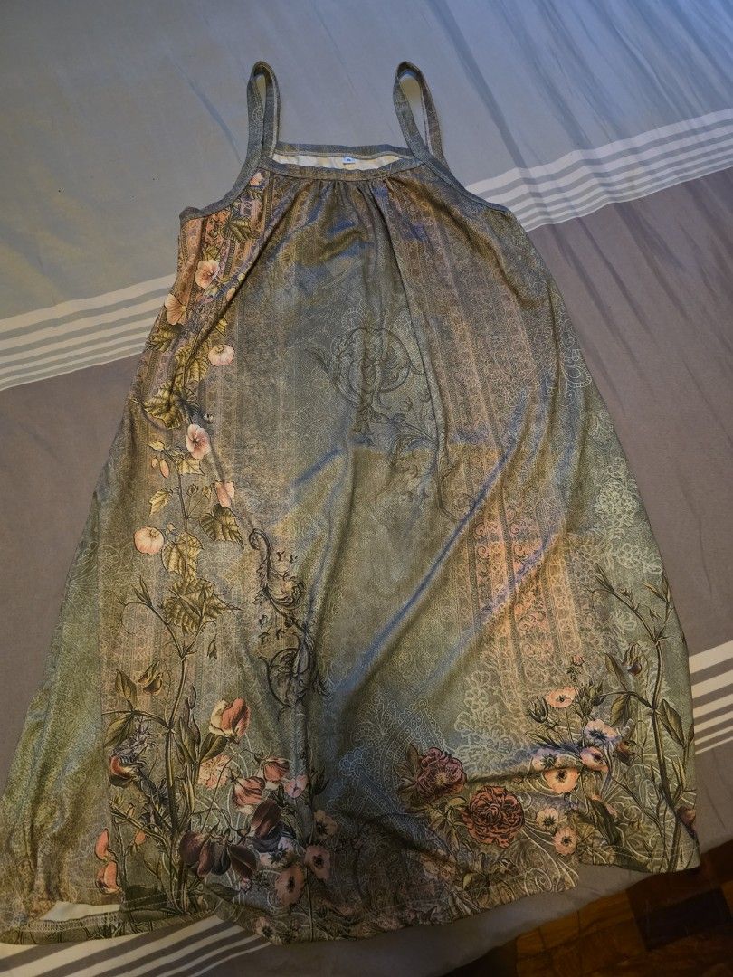 Floral pattern sleeveless strap dress size S (Category: Dresses) located in Manila. Submitted by cher0918 (Listing ID 1465263730, Image 1). Description: - Size: S - Color/Pattern: Green with pink and dark floral print - Design: Scoop neckline, thick straps, flowy fit - Length: Knee-level - Perfect for: Casual outings and warm weather - Condition: Comfortable and easy to throw on.