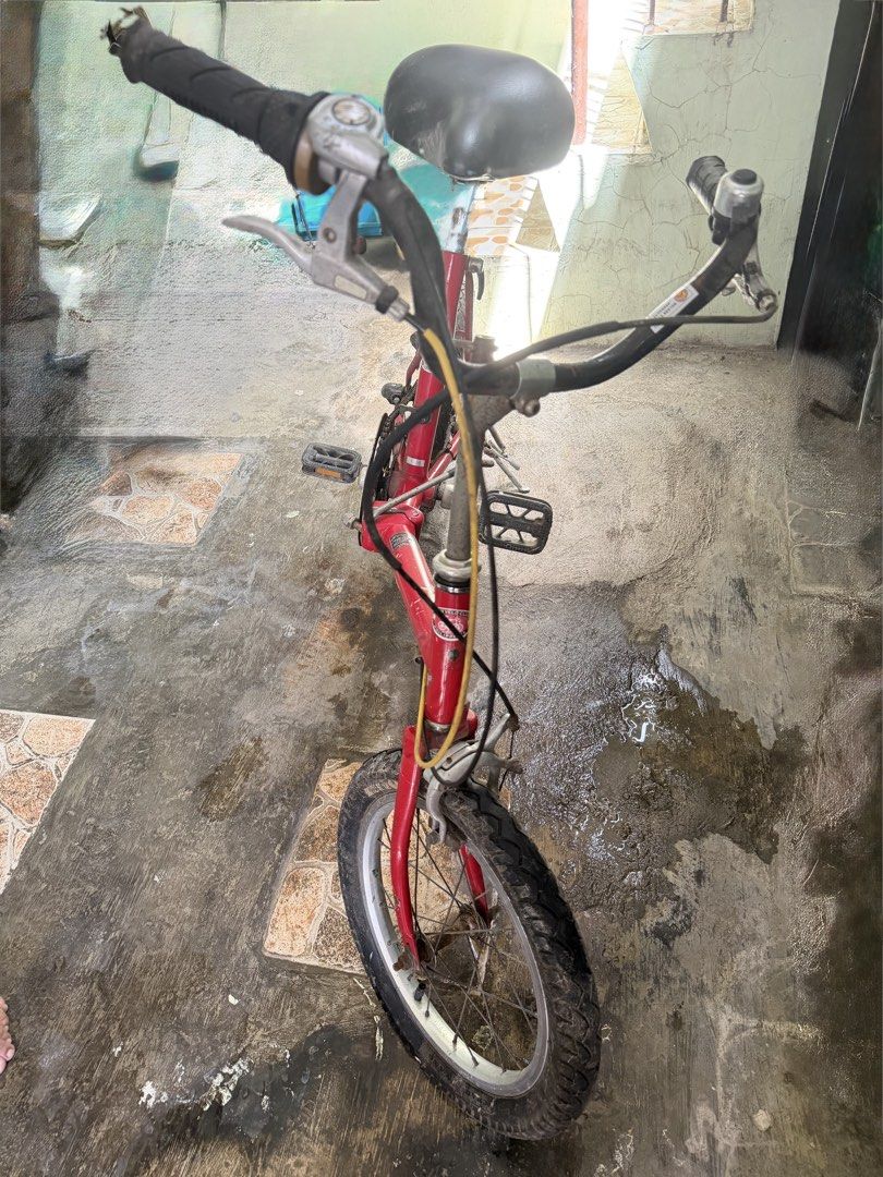 Bridgestone One Touch Picnica Folding Bike (Category: Bicycles) located in Carmona. Submitted by saintkjs (Listing ID 1465213082, Image 2). Description: Bridgestone One Touch Picnica Japanese Folding Bike - Frame: Steel frame with Mini Velo Club Philippines sticker - Wheel size: 16 × 2.10 inches - Tires: Thick tires (still in good condition, just needs air) - Brake: Brake line issue - Rust: Some surface rust on the chain and handlepost due to sto