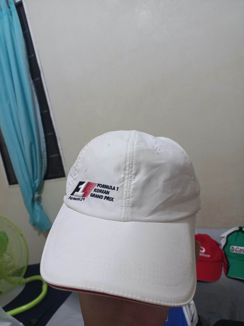Formula 1 Korean Grand Prix White Cap (Category: Caps & Hats) located in Davao. Submitted by thegraildept2026 (Listing ID 1465178714, Image 2). Description: - Authentic White Formula 1 Korean Grand Prix cap - Embroidered F1 logos on the front and side - Stylish red stripe detail running down the back - Adjustable strap with a secure metallic buckle closure - Must-have piece for motorsport fans and collectors.