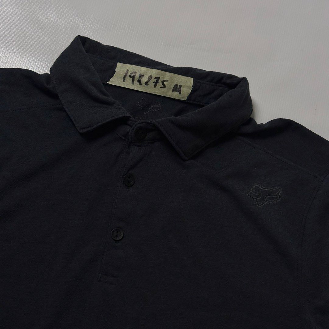 Fox Racing Trudri Tech Polo Shirt Black Medium (Category: Tshirts & Polo Shirts ) located in Manila. Submitted by johnedel_james (Listing ID 1465261771, Image 2). Description: - Brand: Fox Racing - Color: Black - Size: Medium - Material: TruDri moisture-wicking tech fabric - Design: Short sleeves, button placket, collar neckline - Details: Embroidered Fox head logo on chest - Origin: Made in El Salvador - Condition: Excellent / Pre-loved (ready t
