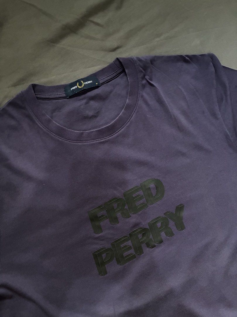 Fred Perry Graphic Tee Purple Size M (Category: Tshirts & Polo Shirts ) located in Taguig. Submitted by arriolamajo (Listing ID 1465228610, Image 2). Description: 100% Authentic Fred Perry t-shirt in dark purple -condition 9.5/10 -Size M -Bold 3D block lettering across the chest with the brand name -Small embroidered laurel wreath logo on the upper back neckline. -cotton fabric .