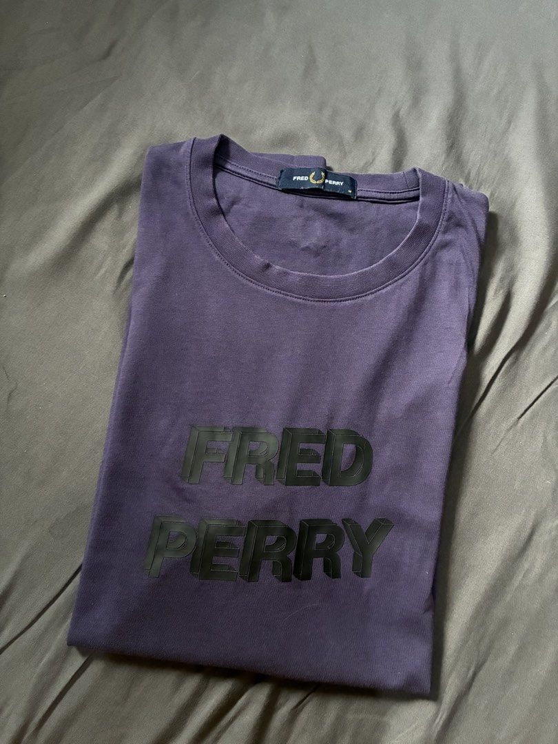 Fred Perry Graphic Tee Purple Size M (Category: Tshirts & Polo Shirts ) located in Taguig. Submitted by arriolamajo (Listing ID 1465228610, Image 1). Description: 100% Authentic Fred Perry t-shirt in dark purple -condition 9.5/10 -Size M -Bold 3D block lettering across the chest with the brand name -Small embroidered laurel wreath logo on the upper back neckline. -cotton fabric .