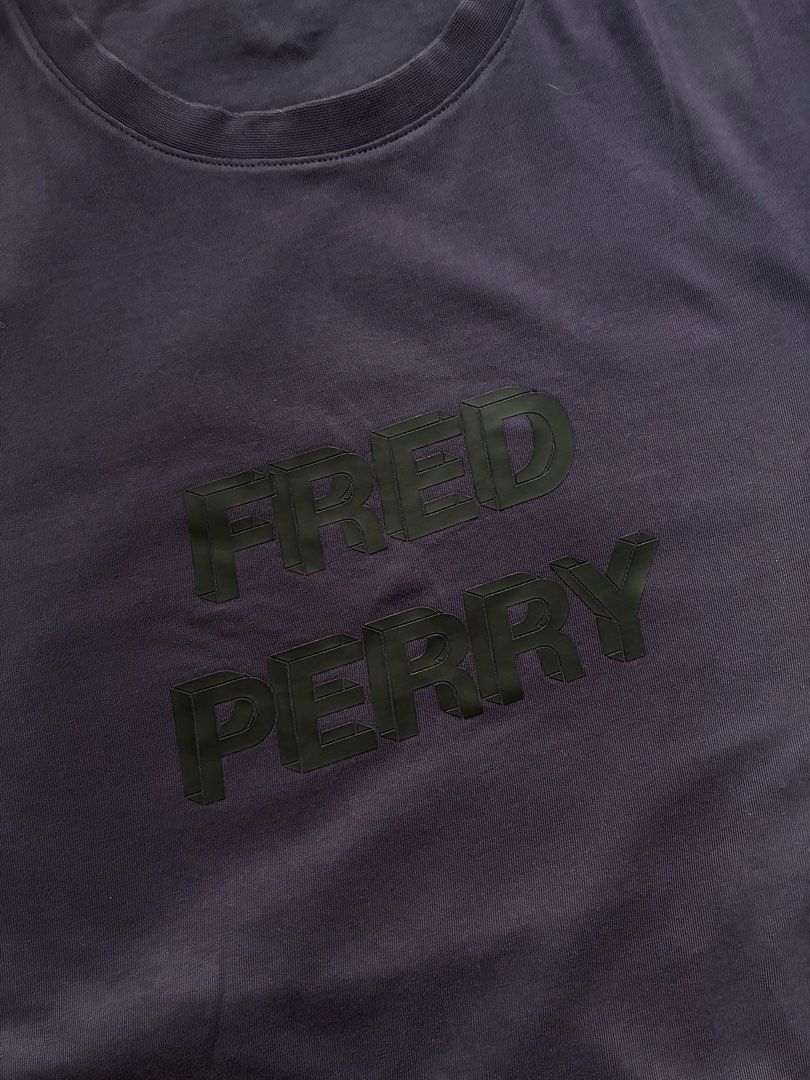 Fred Perry Graphic Tee Purple Size M (Category: Tshirts & Polo Shirts ) located in Taguig. Submitted by arriolamajo (Listing ID 1465228610, Image 3). Description: 100% Authentic Fred Perry t-shirt in dark purple -condition 9.5/10 -Size M -Bold 3D block lettering across the chest with the brand name -Small embroidered laurel wreath logo on the upper back neckline. -cotton fabric .