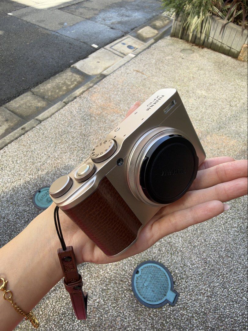 Fujifilm XF10 Compact Digital Camera (No box) (Category: Cameras) located in Cebu City. Submitted by christyyynnn (Listing ID 1465123751, Image 3). Description: - Model: Fujifilm XF10 Compact Digital Camera - Color: Champagne Gold with stylish brown leatherette grip - like new, shutter count less than 300 - Extras: Built-in flash and attached brown strap included - Ideal for: Everyday carry (EDC) and street photography -no box.