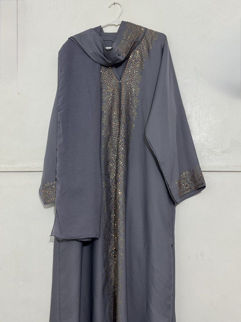 Full Set Abaya for women (Category: Traditional & Ethnic wear) located in Antipolo. Submitted by ecamu1115 (Listing ID 1465177901, Image 1). Description: Bought in Abu Dhabi last August 2026 🇦🇪 Worn only once during my visit to the Sheikh Zayed Grand Mosque. Details: • Size: 52” length • Sleeve length: 25” • Chest: 22.5” • Silk fabric • Color: Porpoise Grey / Slate Grey (approx.) • Comes with matching belt and hijab • Excellent condition — used