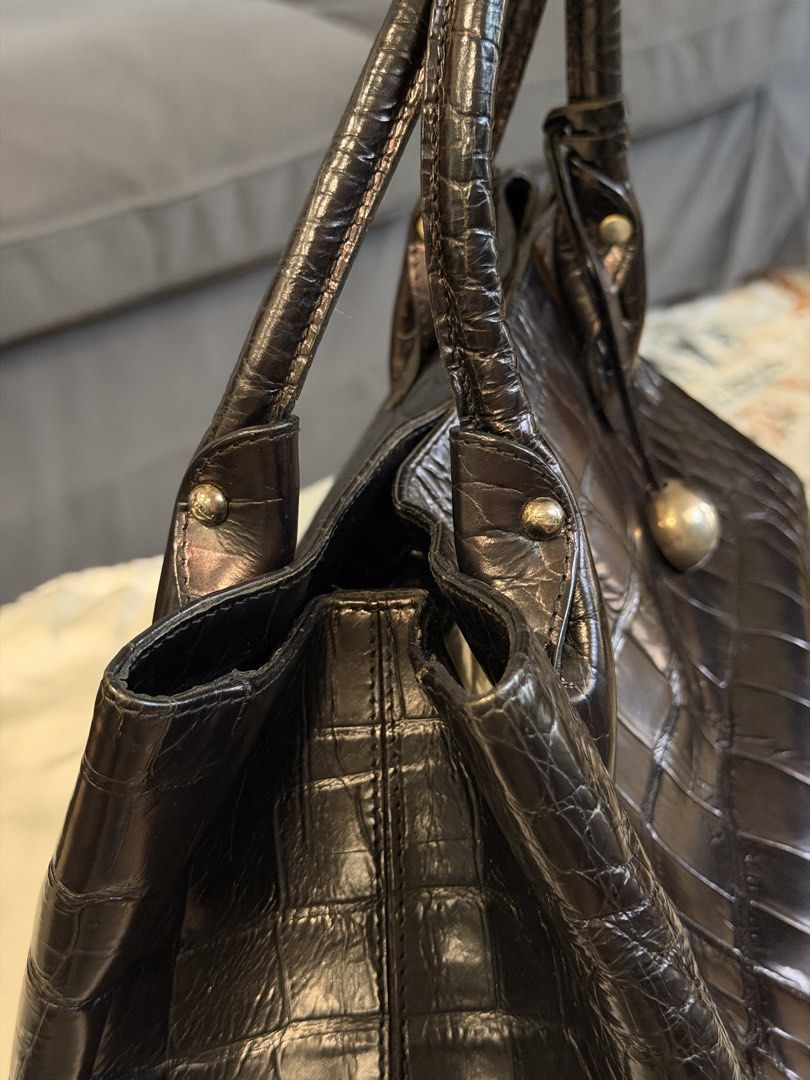 Furla Crocodile Embossed Leather Tote Bag (Category: Luxury Bags & Wallets) located in Santa Rosa. Submitted by ktd312 (Listing ID 1465211002, Image 3). Description: Bag and dust bag only - Brand: Furla (Made in Italy) - Material: Black crocodile-embossed leather - Hardware: Silver-tone with hanging ball charm - Closure: Secure magnetic snap - Interior: Black Furla logo fabric lining with 1 zipped pocket - Handles: Dual top handles for comfortabl