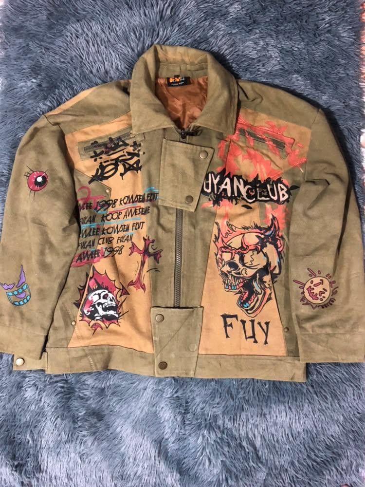 Fuyan Club Graffiti Graphic Print Jacket (Category: Coats, Jackets and Outerwear) located in Malabon City. Submitted by matcha_frappe (Listing ID 1465296764, Image 1). Description: - Color: Tan - Style: Bold streetwear jacket with heavy custom graffiti prints on front and back - Design details: Skull designs, Oni mask, snake graphic, and 'Fuyan Club 1998' typography - Features: Zip-up front, structured collar, and snap button adjustments at the w