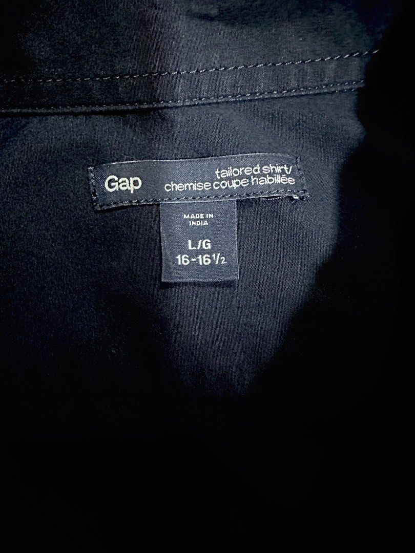 Gap Dark Blue Tailored Shirt Size L (Category: Formal Shirts) located in Quezon City. Submitted by aussomefinds (Listing ID 1465362115, Image 2). Description: - Brand: Gap - Color: Dark Blue (Solid) - Size: Large (Neck 16-16.5 inches) - Fit: Tailored fit - Details: Long sleeves, pointed collar, front button closure - Condition/Origin: Made in India - Style: Versatile for work or smart casual wear, easy to pair with chinos or trousers.