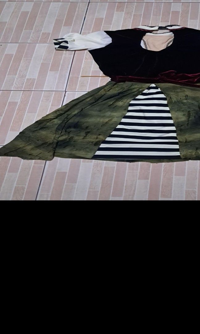 German dirndl dress small-medium (Category: Babies & Kids Fashion) located in Las Pinas. Submitted by kaswakto (Listing ID 1465206856, Image 3). Description: 〽️ Traditional-style German dirndl dress featuring a black velvet-look vest bodice, a white puff-sleeve blouse, an olive-green skirt, and an apron printed with vintage clock graphics. size small-medium 〽️ Dimensions: 39 inches length x 13.5 inches width/ 11 inches waistline 〽️ excellent cond