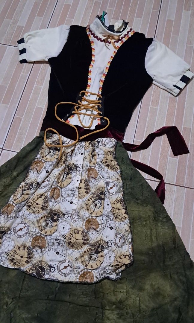 German dirndl dress small-medium (Category: Babies & Kids Fashion) located in Las Pinas. Submitted by kaswakto (Listing ID 1465206856, Image 2). Description: 〽️ Traditional-style German dirndl dress featuring a black velvet-look vest bodice, a white puff-sleeve blouse, an olive-green skirt, and an apron printed with vintage clock graphics. size small-medium 〽️ Dimensions: 39 inches length x 13.5 inches width/ 11 inches waistline 〽️ excellent cond