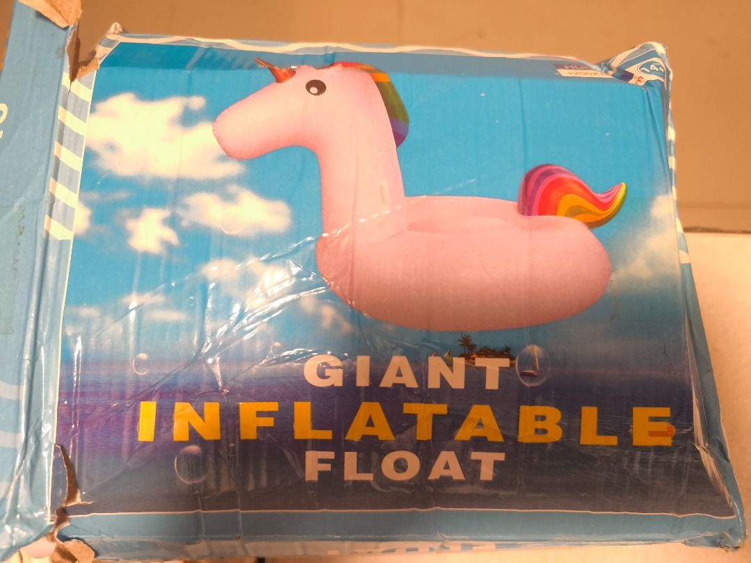 Giant Inflatable Unicorn Pool Float (Category: Water Sports) located in Cebu City. Submitted by purilimmabano (Listing ID 1465351427, Image 1). Description: - Huge unicorn pool float featuring a white body, rainbow mane and tail, and a shiny gold horn - Spacious enough for comfortable adult lounging or fun kids' rides - Used only once for a weekend getaway, then properly cleaned and dried - Original box included (slightly crumpled from storage).