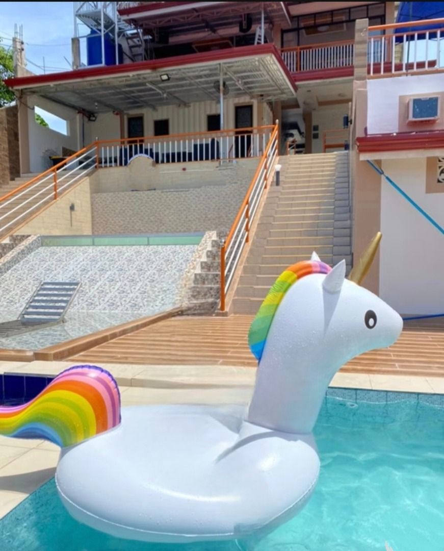 Giant Inflatable Unicorn Pool Float (Category: Water Sports) located in Cebu City. Submitted by purilimmabano (Listing ID 1465351427, Image 3). Description: - Huge unicorn pool float featuring a white body, rainbow mane and tail, and a shiny gold horn - Spacious enough for comfortable adult lounging or fun kids' rides - Used only once for a weekend getaway, then properly cleaned and dried - Original box included (slightly crumpled from storage).