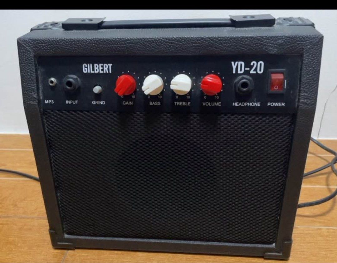 Gilbert YD-20 Electric Guitar Amplifier (Category: Musical Instruments) located in Manila. Submitted by kingsophi3 (Listing ID 1465233559, Image 1). Description: - Model: Gilbert YD-20 Practice Amp - Design: Black textured finish with black metal grille - Controls: Gain, bass, treble, volume, and grind switch - Connectivity: Guitar input, MP3 input, and headphone jack - Power: AC 220V-240V 50Hz (power switch on the right side) - Condition: Clean 