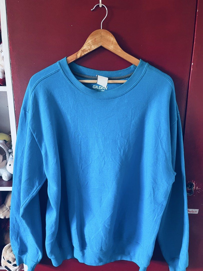 Gildan Sweatshirt (Category: Activewear) located in Quezon City. Submitted by wacpon_061972 (Listing ID 1465205903, Image 1). Description: This is a bright blue crewneck sweattshirt by the brand Gildan. .