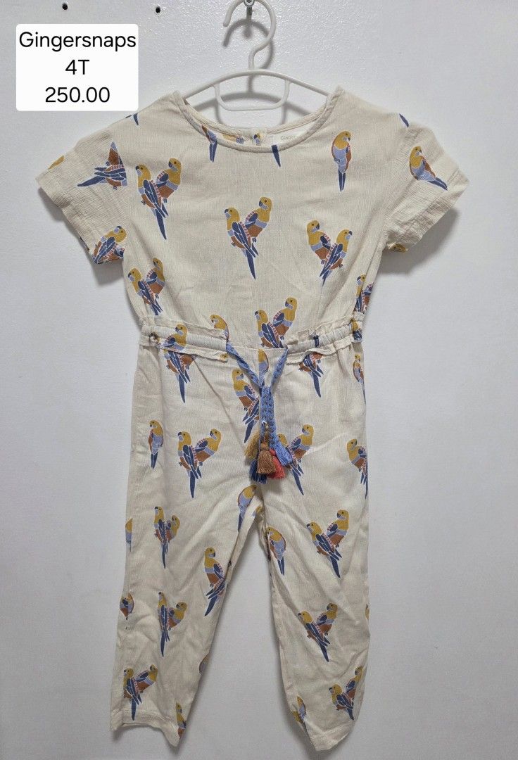 Gingersnaps Bird Print Jumpsuit Size 4T (Category: Babies & Kids Fashion) located in Bulacan. Submitted by farfinfab (Listing ID 1465377452, Image 1). Description: - Brand: Gingersnaps - Size: 4T - Design: Cream background with colorful blue and yellow bird all-over print - Features: Short sleeves, elastic waistband, and decorative tassel drawstring - Material: Lightweight and comfortable for daily wear - Condition: Clean and ready to ship.