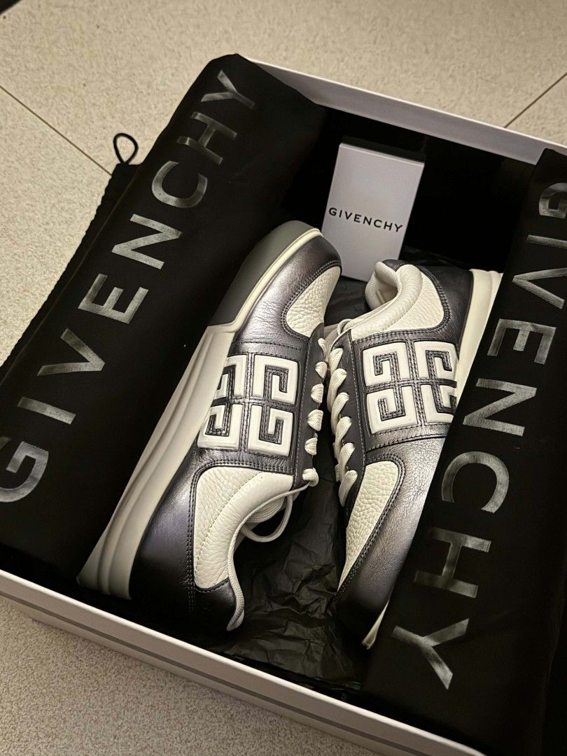 Givenchy Metallic Leather Sneakers White and Silver (Category: Sneakers) located in San Mateo. Submitted by meymei91 (Listing ID 1465216578, Image 3). Description: - Brand: Givenchy - Color: White and metallic silver - Style: Chunky silhouette with iconic 4G logo and contrast tumbled leather panels - Soles: Thick rubber soles - Condition: Brand new, never worn - Inclusions: Original branded box and dust bags included.