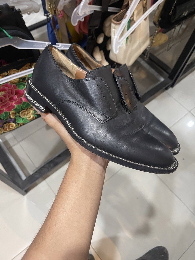 Givenchy Paris Black Leather Chain Trim Loafers (Category: Loafers) located in Cavite. Submitted by thriftkicks3 (Listing ID 1465282630, Image 1). Description: - Brand: Givenchy Paris - Color: Black with natural tan leather interior lining - Style: Edgy designer slip-on flats with distinctive chain detail along the welt and heel - Condition: Good pre-loved condition with normal creasing on top and minor scuffs at the heels - Perfect for adding a 