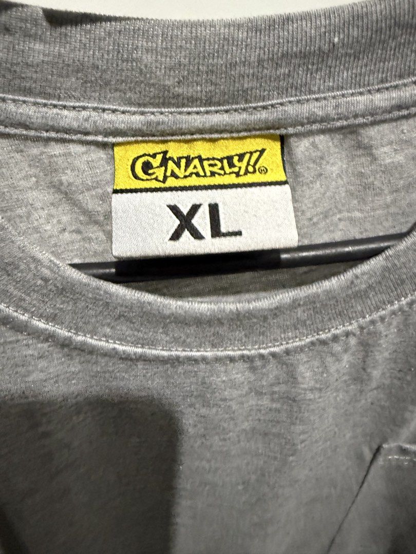 Gnarly Long Sleeve (Category: Tshirts & Polo Shirts ) located in Mandaluyong City. Submitted by whitemoveout (Listing ID 1465325794, Image 2). Description: - Brand: Gnarly! - Size: XL - Color: Heather grey - Material: Cotton blend - Design: Long sleeve with standard crew neckline - Details: Chest pocket with 'G!' logo patch and small yellow/black hem tag - Condition: Excellent / Well-maintained.
