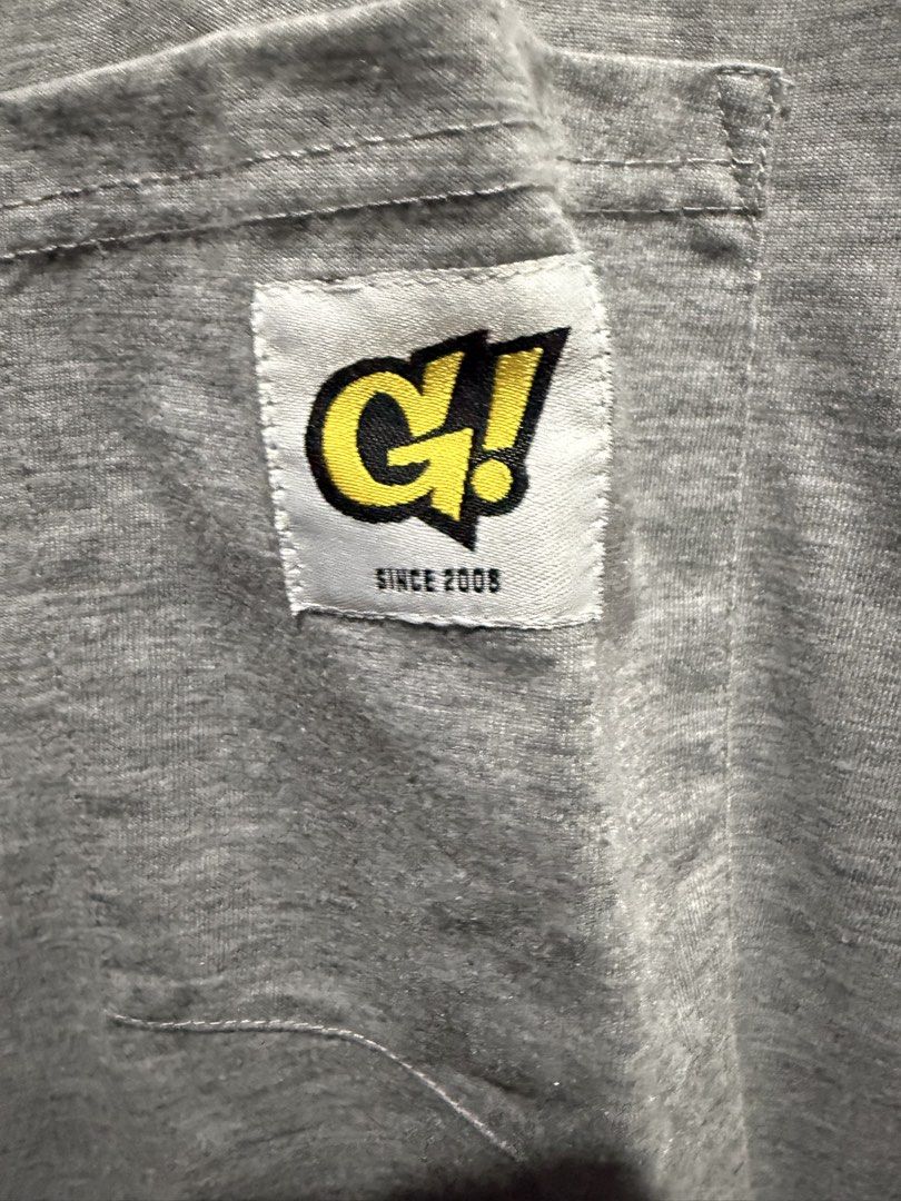 Gnarly Long Sleeve (Category: Tshirts & Polo Shirts ) located in Mandaluyong City. Submitted by whitemoveout (Listing ID 1465325794, Image 3). Description: - Brand: Gnarly! - Size: XL - Color: Heather grey - Material: Cotton blend - Design: Long sleeve with standard crew neckline - Details: Chest pocket with 'G!' logo patch and small yellow/black hem tag - Condition: Excellent / Well-maintained.