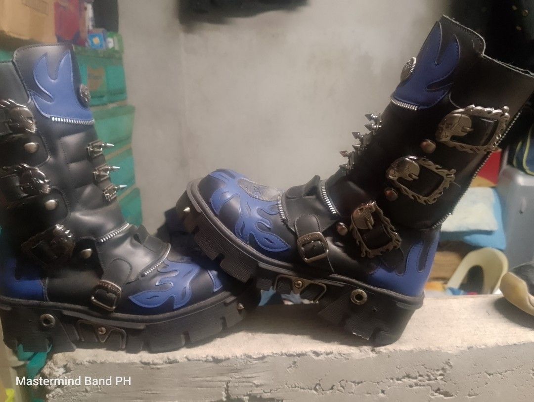 Goth Punk Platform Boots Blue Black Skull Spikes (Category: Boots) located in Cavite. Submitted by paul_nilayan (Listing ID 1465348394, Image 1). Description: - Color & Design: Black with vibrant blue flame details and skull appliques - Hardware: Loaded with metal spikes, studs, and multiple buckles - Features: Convenient side zippers and a chunky lug sole for maximum height and grip - Build: Heavy-duty and durable construction - Style: Ideal for