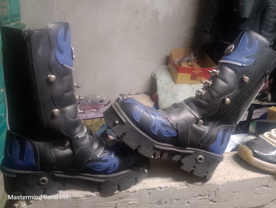 Goth Punk Platform Boots Blue Black Skull Spikes (Category: Boots) located in Cavite. Submitted by paul_nilayan (Listing ID 1465348394, Image 3). Description: - Color & Design: Black with vibrant blue flame details and skull appliques - Hardware: Loaded with metal spikes, studs, and multiple buckles - Features: Convenient side zippers and a chunky lug sole for maximum height and grip - Build: Heavy-duty and durable construction - Style: Ideal for