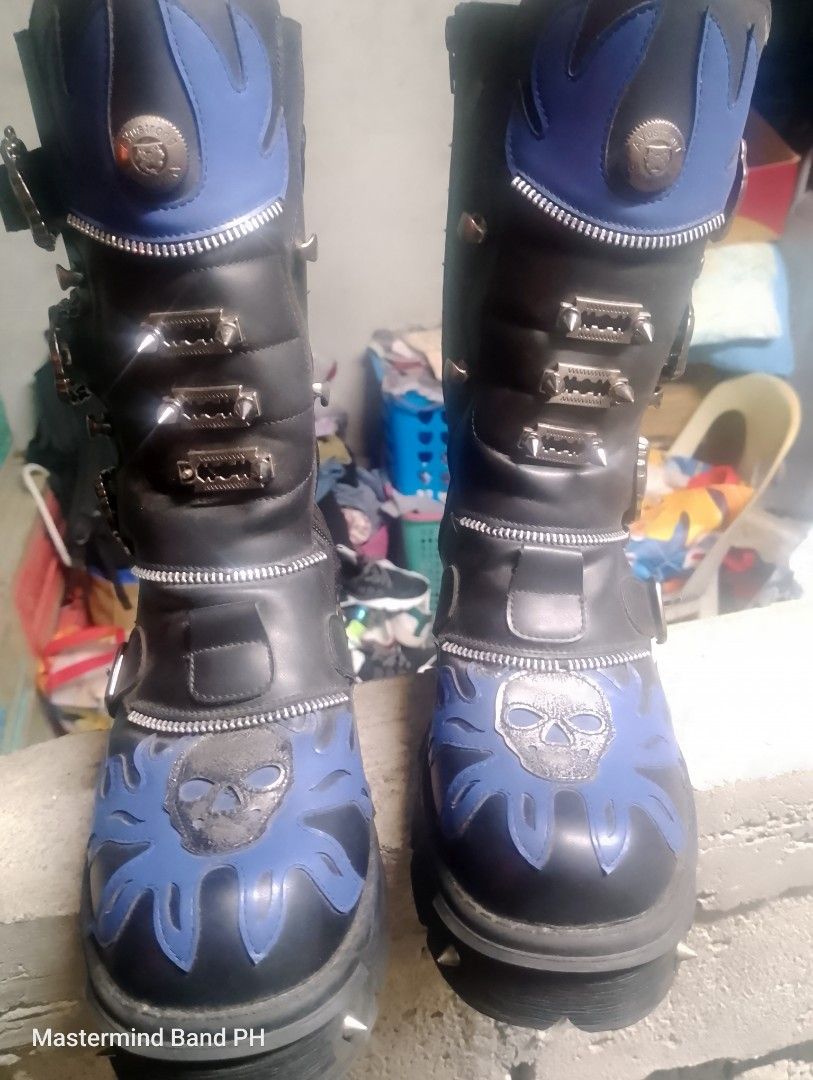 Goth Punk Platform Boots Blue Black Skull Spikes (Category: Boots) located in Cavite. Submitted by paul_nilayan (Listing ID 1465348394, Image 2). Description: - Color & Design: Black with vibrant blue flame details and skull appliques - Hardware: Loaded with metal spikes, studs, and multiple buckles - Features: Convenient side zippers and a chunky lug sole for maximum height and grip - Build: Heavy-duty and durable construction - Style: Ideal for