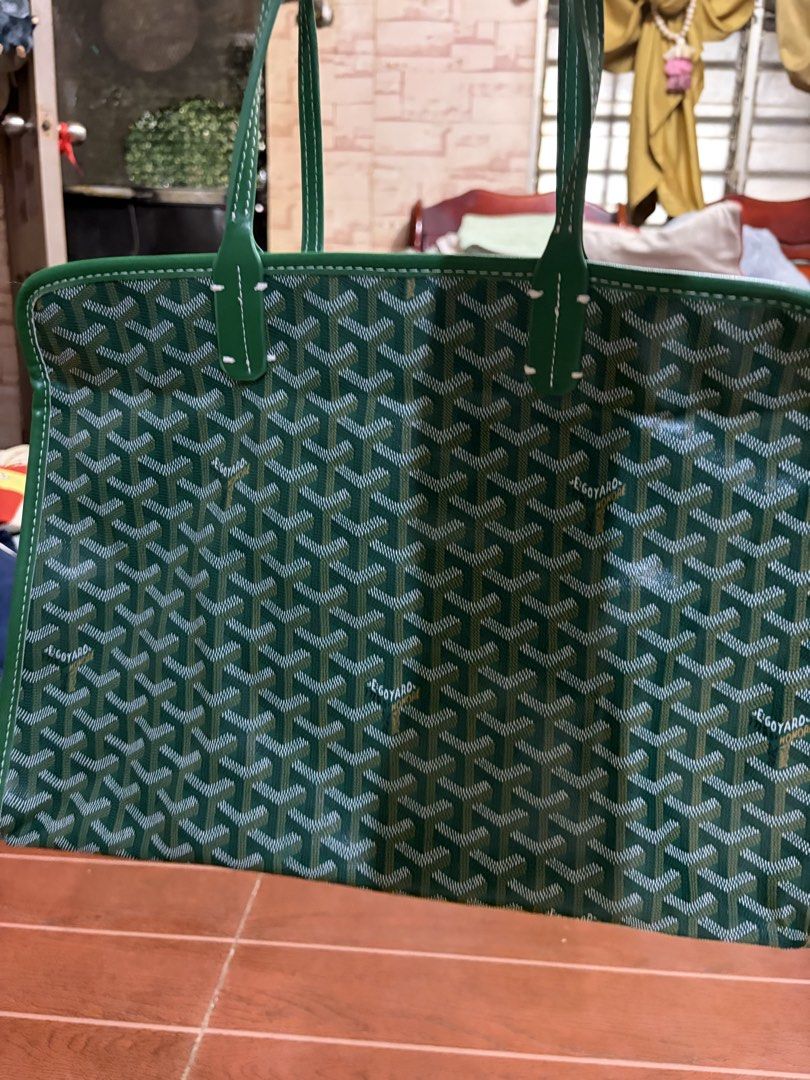 Goyard Green Tote Bag with Pouch (Category: Luxury Bags & Wallets) located in Manila. Submitted by lynnalec25 (Listing ID 1465363097, Image 2). Description: - Color: Vibrant green with iconic Goyard chevron pattern - Material & Trim: Premium build with solid green leather trim and dual top handles - Includes: Matching detachable pouch that snaps onto the front exterior - Closure: Secure zip top closure along the top panel - Details: Perforated Go