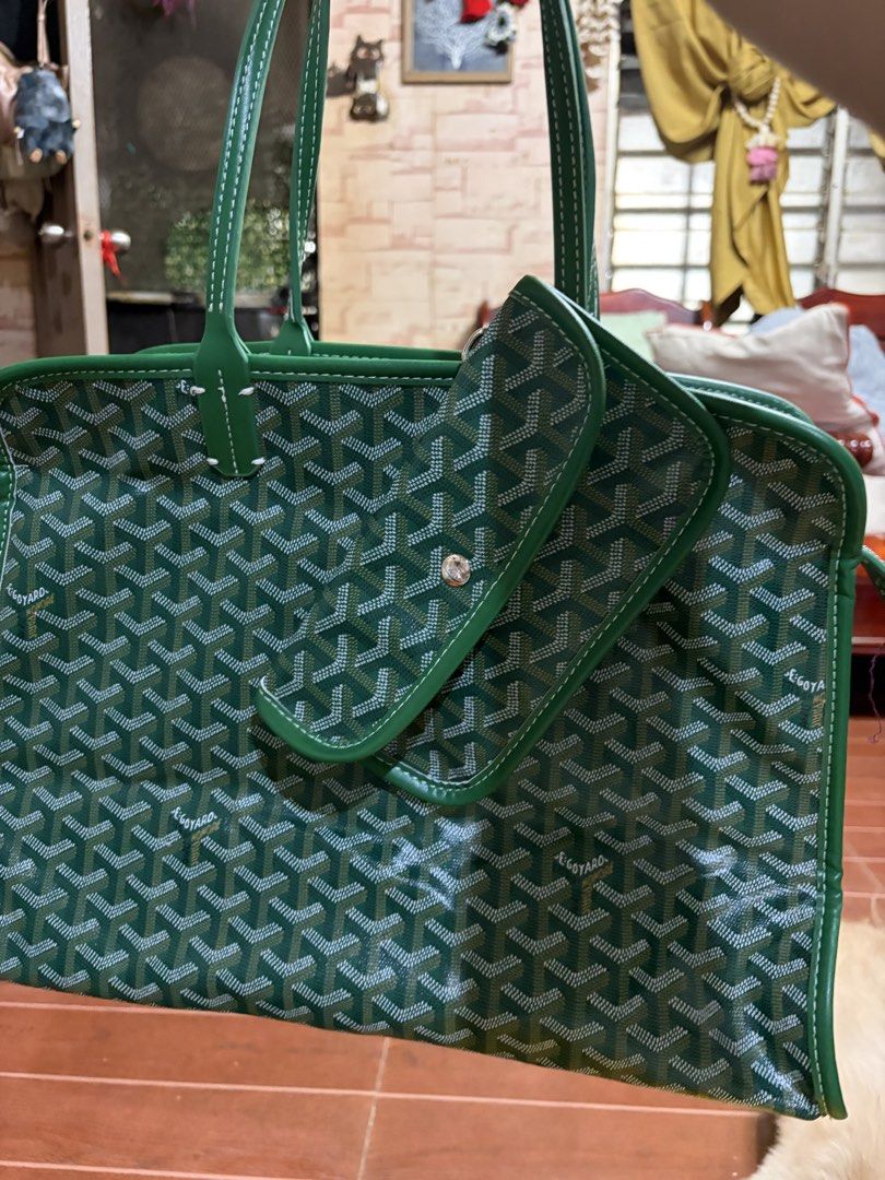 Goyard Green Tote Bag with Pouch (Category: Luxury Bags & Wallets) located in Manila. Submitted by lynnalec25 (Listing ID 1465363097, Image 1). Description: - Color: Vibrant green with iconic Goyard chevron pattern - Material & Trim: Premium build with solid green leather trim and dual top handles - Includes: Matching detachable pouch that snaps onto the front exterior - Closure: Secure zip top closure along the top panel - Details: Perforated Go