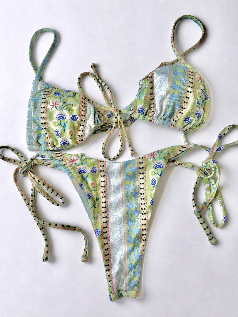 Green Floral Print Two-Piece Bikini Set (Category: Bikinis & Swimsuits) located in Manila. Submitted by ynaamo (Listing ID 1465264280, Image 1). Description: Gorgeous green bikini set featuring a blue floral and geometric print. Made with ribbed textured fabric, adjustable string ties on the top and bottoms, and gathered triangle cups. Perfect for your next beach trip or vacation..