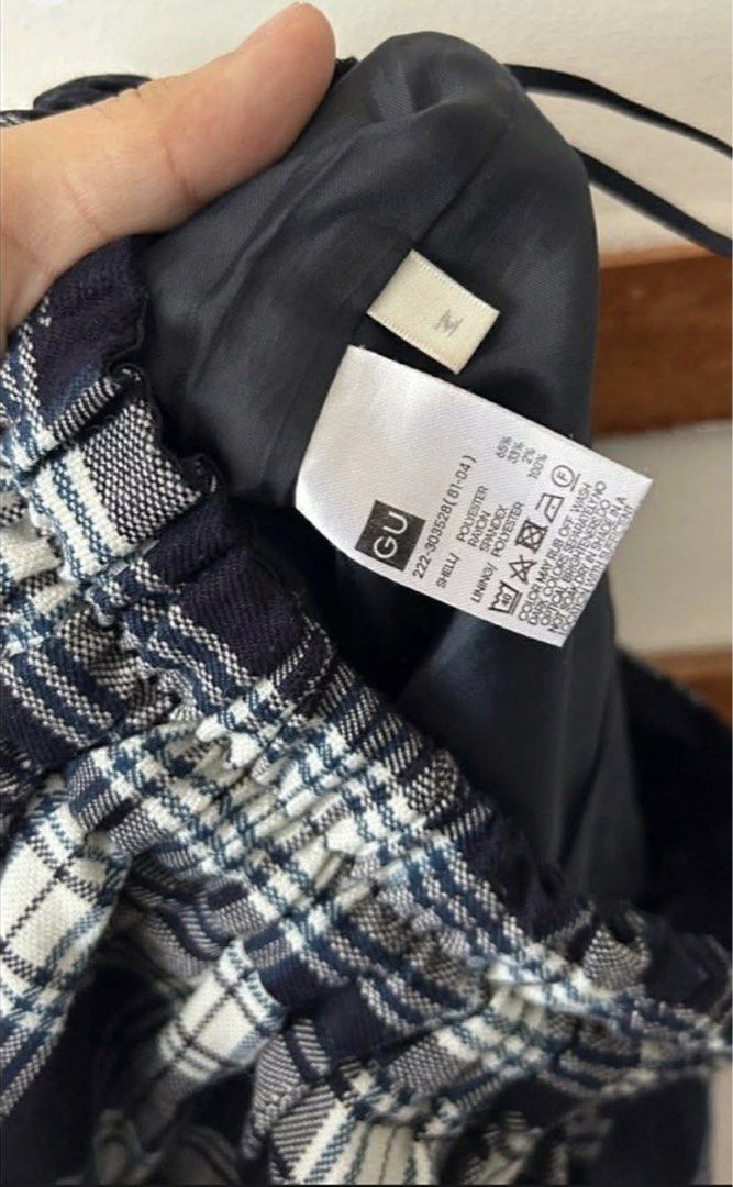 GU Blue Plaid Skirt Size M (Category: Skirts) located in Manila. Submitted by andreaangc05357 (Listing ID 1465266571, Image 2). Description: - Brand: GU - Style: Blue and white plaid skirt - Condition: Brand new with tag attached (BNWT) - Size: M - Material: Poly-rayon-spandex blend with polyester lining - Waist: Elastic waistband with adjustable drawstring - Care: Machine washable - Perfect comfortable piece for everyday wear.