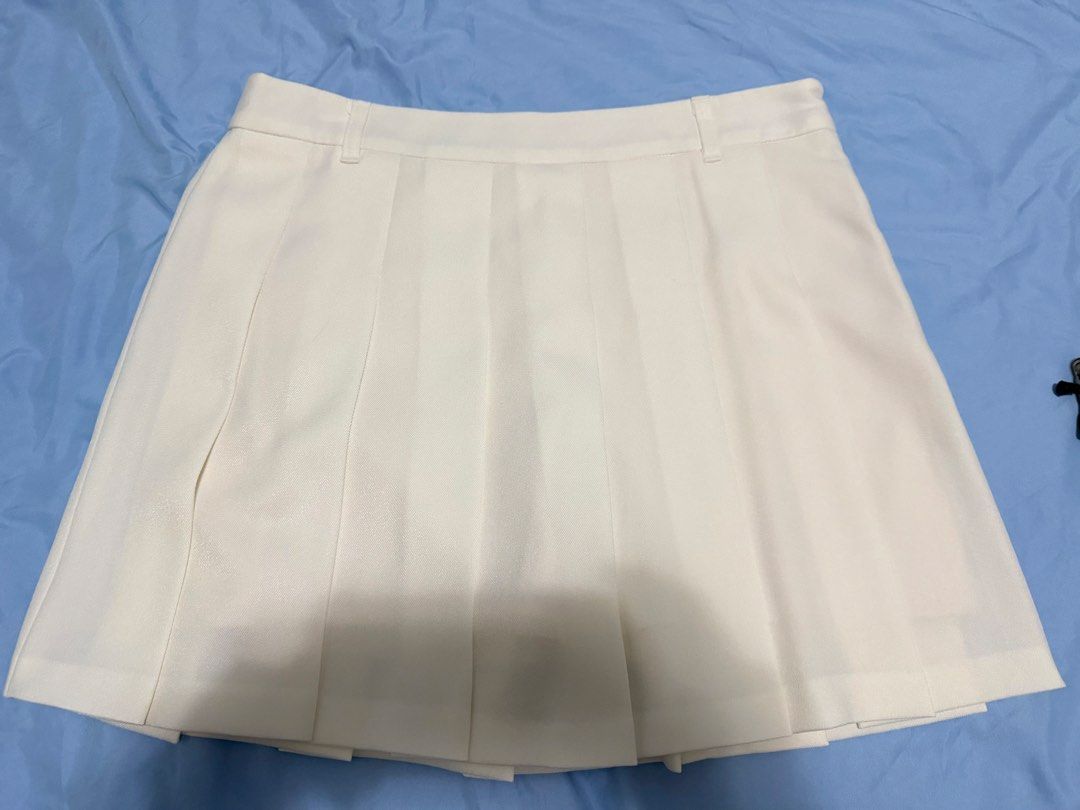 GU White Pleated Skort Size XL (Category: Skirts) located in Quezon City. Submitted by herbsandhealthdeals (Listing ID 1465288835, Image 1). Description: - Brand: GU - Color: White - Style: Pleated skirt with built-in shorts for extra coverage - Size: XL (Approx. 16" flat waist Fits 33-34 inches waist Used once Personal preloved Steamed and washed Lalamove ready.