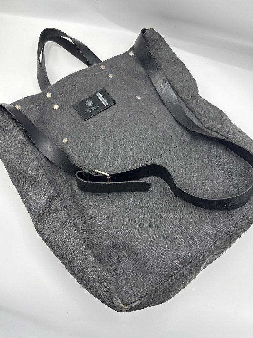 Gucci bag (Category: Sling Bags) located in Caloocan City. Submitted by rossvault2 (Listing ID 1465231710, Image 2). Description: Gucci tote bag in dark grey or black canvas with the classic interlocking G monogram pattern. Black leather handles and an adjustable shoulder strap. Large front slip pocket and zipped rear pocket, both with branded hardware. Gucci logo patch sewn onto the front center. -authentic -needs cleaning/bagspa -normal signs o