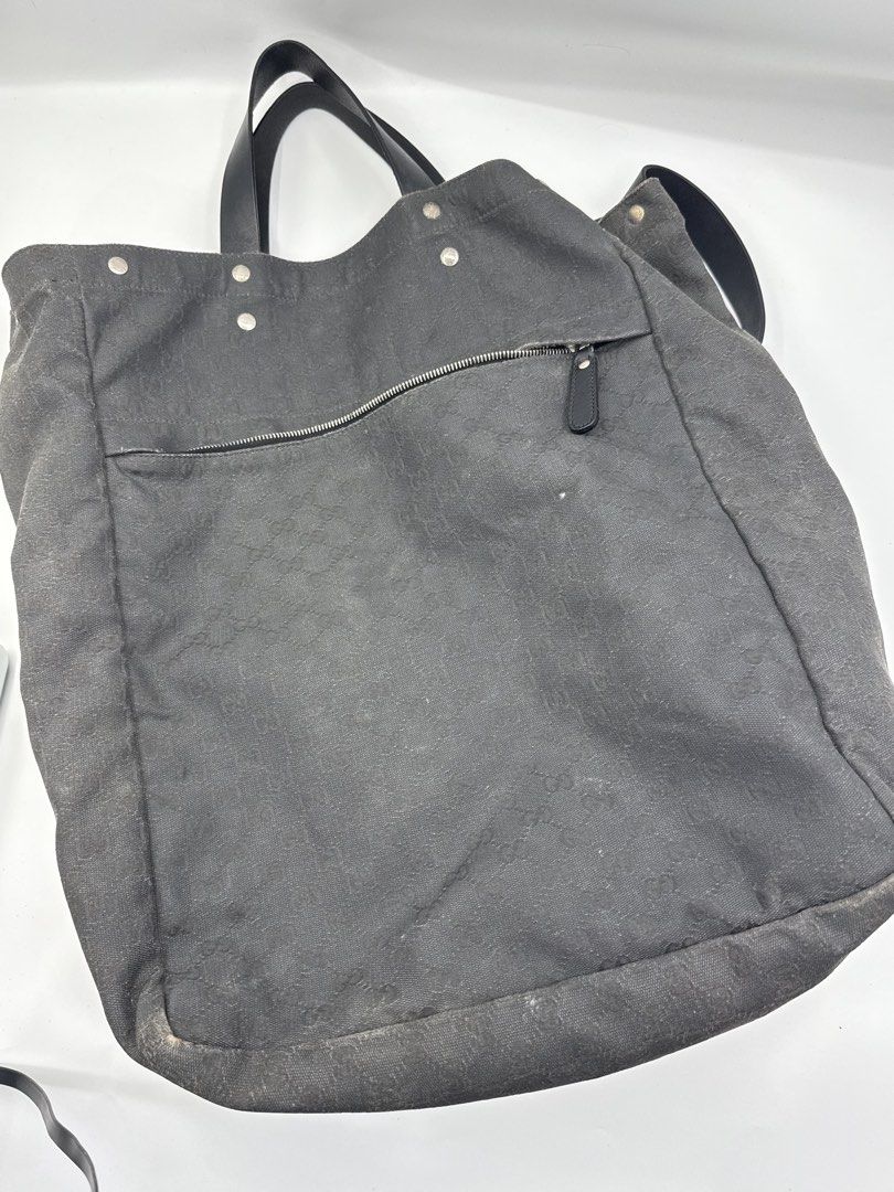 Gucci bag (Category: Sling Bags) located in Caloocan City. Submitted by rossvault2 (Listing ID 1465231710, Image 3). Description: Gucci tote bag in dark grey or black canvas with the classic interlocking G monogram pattern. Black leather handles and an adjustable shoulder strap. Large front slip pocket and zipped rear pocket, both with branded hardware. Gucci logo patch sewn onto the front center. -authentic -needs cleaning/bagspa -normal signs o