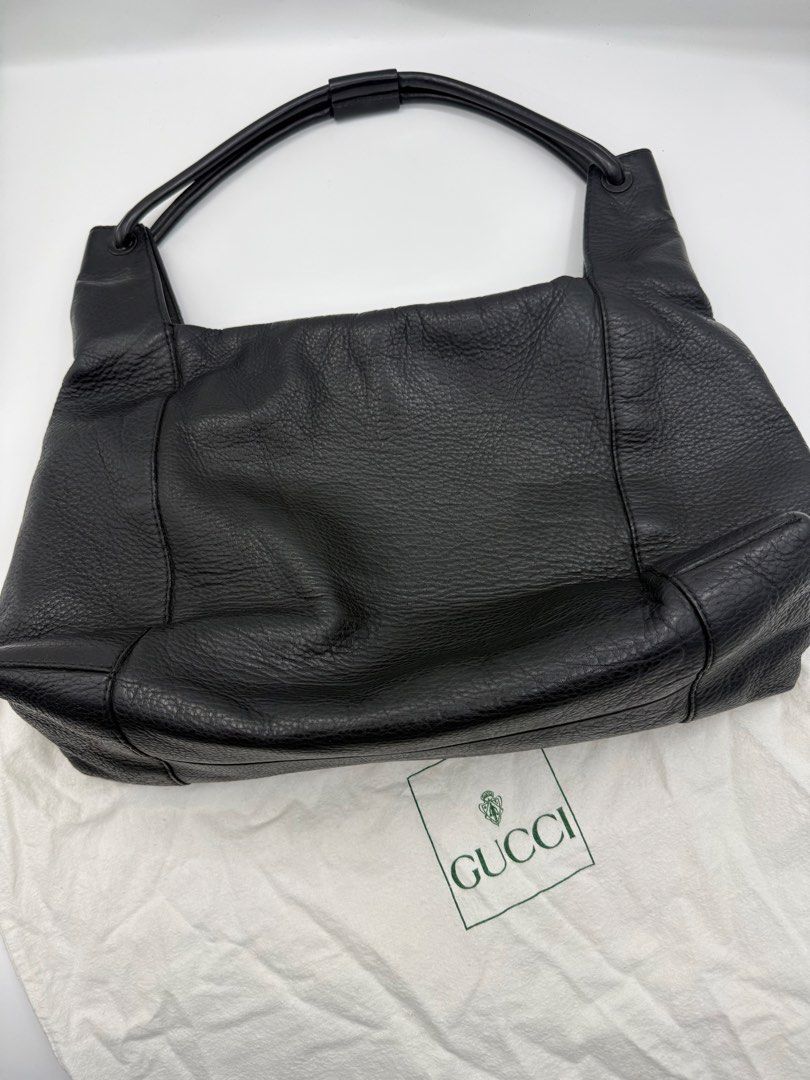Gucci Black Leather Shoulder Bag (Category: Shoulder Bags) located in Caloocan City. Submitted by rossvault2 (Listing ID 1465237110, Image 1). Description: - Brand: authentic Gucci Pure leather - Color: Classic Black - Material: Premium pebbled leather with structured handles - Closure: Secure zip-top - Interior: Spacious enough for your phone, wallet, and keys - Style: Clean, minimalist, and timeless for day-to-night wear - Inclusion: Comes with
