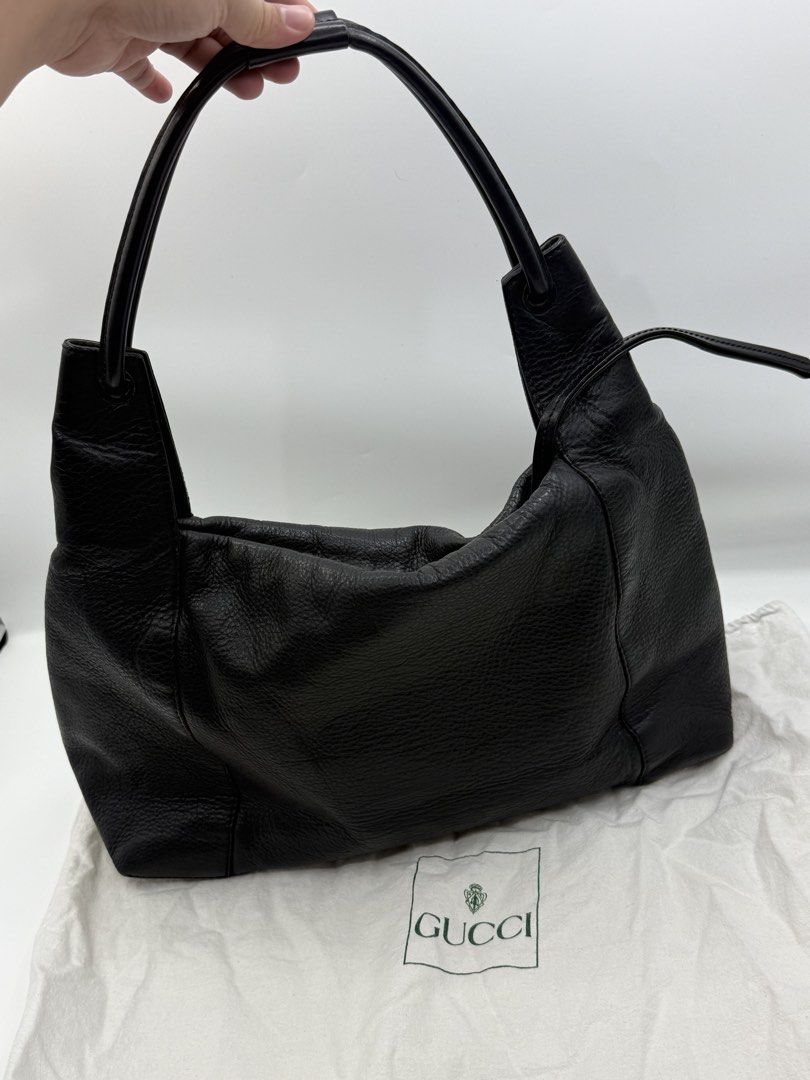 Gucci Black Leather Shoulder Bag (Category: Shoulder Bags) located in Caloocan City. Submitted by rossvault2 (Listing ID 1465237110, Image 2). Description: - Brand: authentic Gucci Pure leather - Color: Classic Black - Material: Premium pebbled leather with structured handles - Closure: Secure zip-top - Interior: Spacious enough for your phone, wallet, and keys - Style: Clean, minimalist, and timeless for day-to-night wear - Inclusion: Comes with