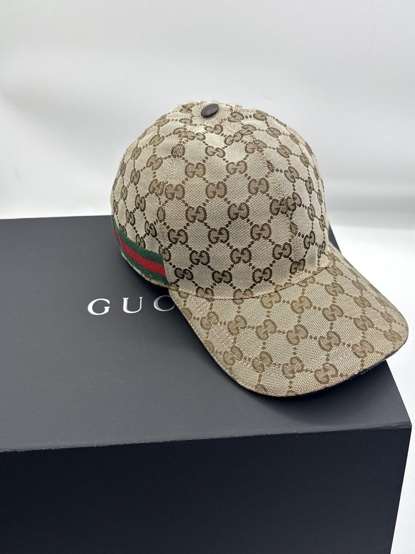 Gucci cap (Category: Caps & Hats) located in Caloocan City. Submitted by rossvault2 (Listing ID 1465228040, Image 2). Description: - 100% Authentic Gucci baseball cap - Classic GG Supreme canvas pattern in beige and brown tones - Signature green and red web detail along the side - Dark brown top button accent - box not included - Perfect for daily wear or elevating any streetwear fit - DM for more pictures or inquiries! -needs cleaning.