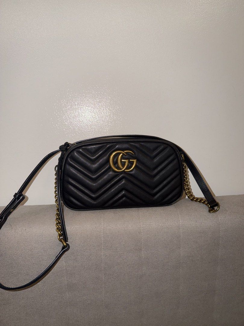 Gucci Marmont Camera Shoulder Bag Black Authentic (Category: Luxury Bags & Wallets) located in Rosales. Submitted by santaclarita.ph (Listing ID 1465349972, Image 1). Description: - Brand: Gucci - Style: Marmont Shoulder Bag - Material: Black leather - Hardware: Antique gold with signature interlocking G logo - Strap: Adjustable chain and leather strap - Closure: Secure zip-top closure Price negotiable.