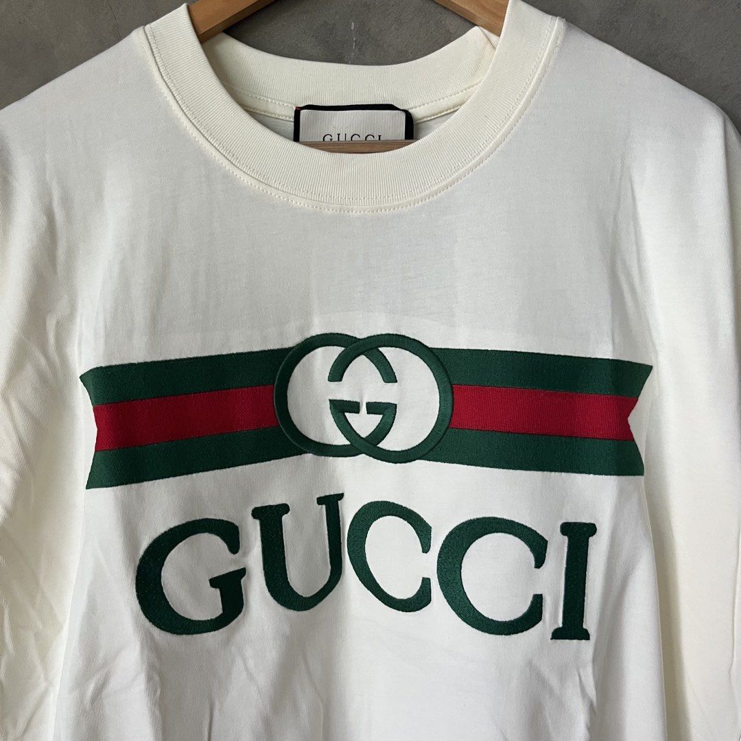 Gucci White Interlocking G Logo T-Shirt (Category: Activewear) located in Davao. Submitted by gotchastuff (Listing ID 1465268388, Image 2). Description: - 100% Authentic Gucci Short Sleeve Tee - Color: Off-white - Size: Small - Dimes 22x29 - Material: Premium cotton, Made in Italy - Design: Classic green/red web stripe, embroidered interlocking G logo, and bold Gucci lettering - Condition: Brand new with original paper hang tag attached - Guarant