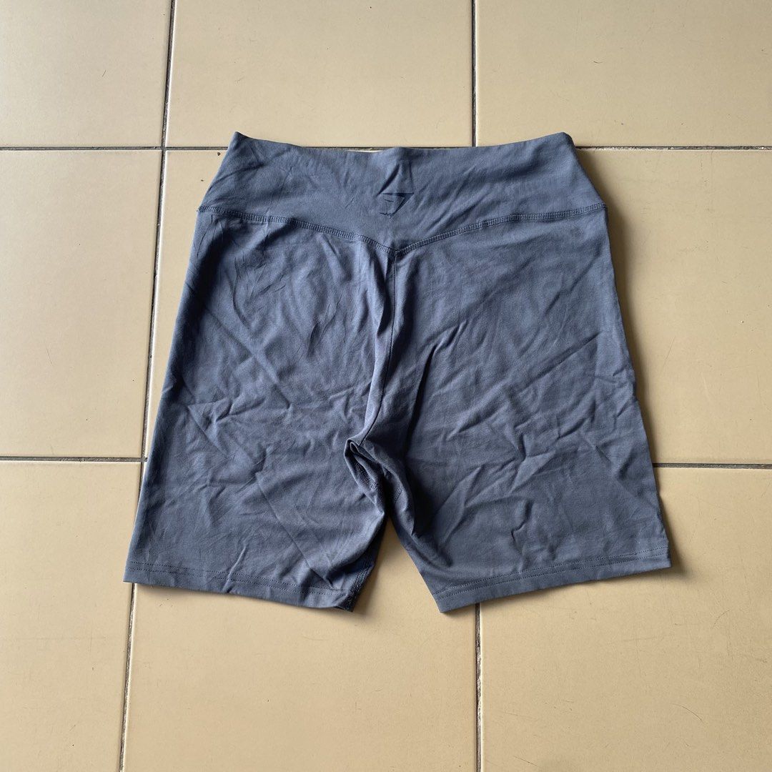 Gymshark Lifting Essentials Grey Biker Shorts Size L (Category: Activewear) located in Bogo. Submitted by royalivio069630 (Listing ID 1465228910, Image 3). Description: - Brand: Gymshark - Item: Grey bike shorts - Size: Large (with tag attached) - Material: 89% cotton, 11% elastane (super comfortable and stretchy) - Details: Lifting essentials graphic near the hem and logo stamped on the back waistband - Condition: Brand new - Perfect for gym wor