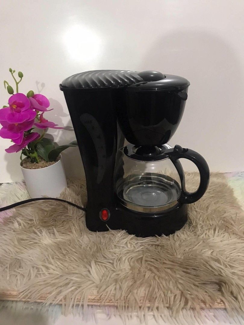 Hanabishi Coffee Maker HCM-10B with box (Category: Coffee Machines & Makers) located in Marilao. Submitted by appleanne56789-08626 (Listing ID 1465211068, Image 2). Description: - Brand: Hanabishi Coffee Maker - Model: HCM-10B (Classic Black Finish) - Inclusions: Original glass carafe, reusable filter basket, and box - Features: Easy on/off switch with indicator light, side water level window - Condition: Clean inside and out, excellent for daily