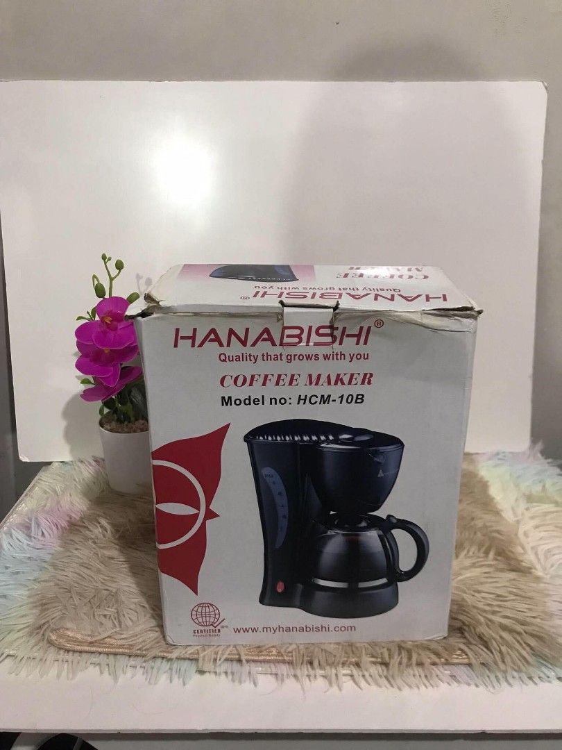 Hanabishi Coffee Maker HCM-10B with box (Category: Coffee Machines & Makers) located in Marilao. Submitted by appleanne56789-08626 (Listing ID 1465211068, Image 1). Description: - Brand: Hanabishi Coffee Maker - Model: HCM-10B (Classic Black Finish) - Inclusions: Original glass carafe, reusable filter basket, and box - Features: Easy on/off switch with indicator light, side water level window - Condition: Clean inside and out, excellent for daily