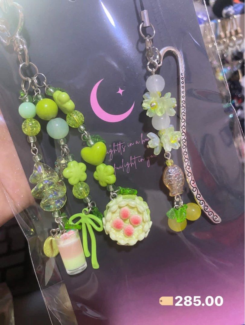 Handmade Totoro Beaded Keychain and Bookmark Set (Category: Charms) located in Tanauan. Submitted by mariacraftcorner (Listing ID 1465308985, Image 2). Description: - Handmade multi-colored beaded charms featuring adorable Totoro characters, soot sprites, cherries, flowers, and tiny drinks - Multi-functional: use as a bag charm, key chain, or attach the included metal bookmark hook for reading - Price: ₱285 each or ₱1,500 for the complete set.